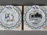 pair of decorative plates depicting scenes from the life of the people of france