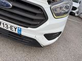 a close up of the front of a white ford vehicle