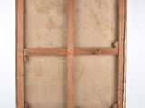 an old wooden box with a piece of paper inside of it