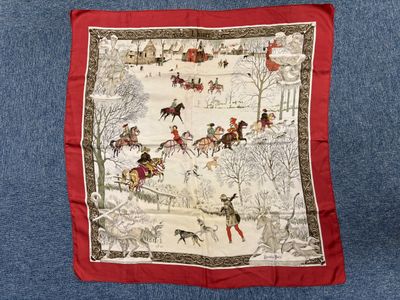 an image of a red and white scarf with a picture of horses and riders