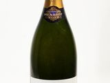 a close up of a bottle of champagne on a white background