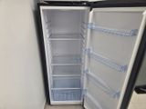 an empty refrigerator with its door open in a kitchen