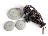 a picture of a blue and gold vase and plates