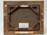 an old wooden picture frame with a label on it