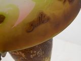 a close up of a glass vase with butterflies on it