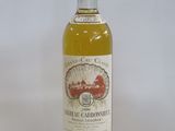 a bottle of wine that is sitting on a table