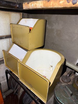 two boxes that are sitting on top of a shelf