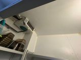 a refrigerator with a lot of dishes and cups in it