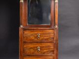 an old wooden cabinet with a mirror on top of it