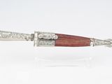 un stylo ancien en argent et bois, avec un manche en bois
