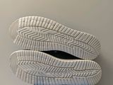 a pair of shoes that are on top of a blue box