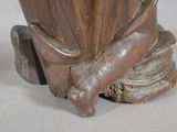a close up of a statue of a bird on a pedestal