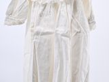 an image of a white shirt hanging on a hanger