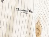 the back of a shirt with a logo on it that says christian dior couture