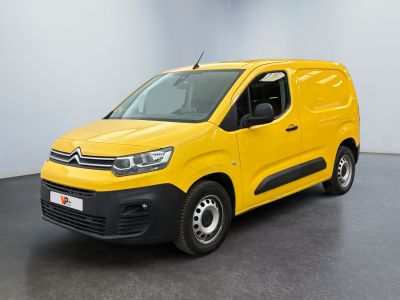 a yellow van parked in a room with a black floor