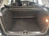 a trunk of a car with the back seats folded down