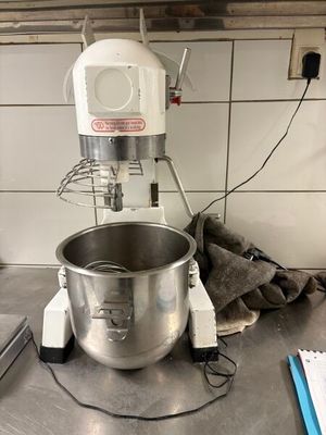 a mixer that is sitting on a counter in a kitchen