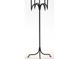 a black metal candelier with three candles on a stand