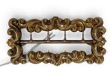 a close up of a gold colored metal buckle on a white background