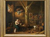 tableau représentant un homme et une femme dans une grange, en compagnie d'un chien
