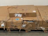 a cardboard box sitting on top of a pallet in a warehouse