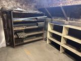 a room that has a bunch of shelves in it