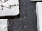 a close up picture of a piece of stone with a flower on it