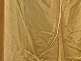 a picture of a bed with a white sheet on it