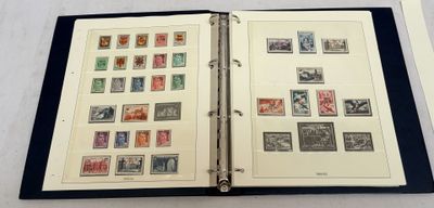 an open book with stamps on it sitting on a table