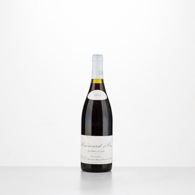 a bottle of red wine sitting on top of a table