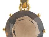 un gros plan d'un pendentif en or orné d'un quartz fumé
