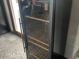 a wine cooler that has a bottle of wine in it