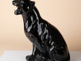 an image of a black panther statue on a white surface