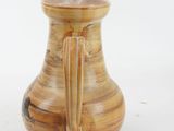 a brown vase with a handle on a white background