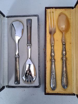 silverware in a box with a spoon, fork and spoon rest