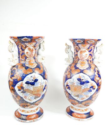 two vases sitting side by side on a white surface