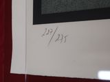 a piece of paper with writing on it in front of a red curtain