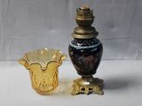 two vases sitting next to each other on a table