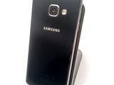 a close up of a cell phone on a stand