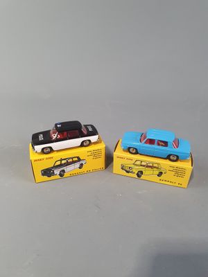 two small toy cars are sitting on top of a box