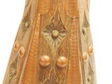 a wooden vase that has a gold decoration on it