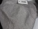 a hat that has a tag on it on a mannequin