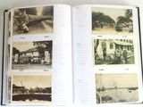 a book opened to show pictures of people and buildings