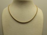 a close up of a mannequin with a necklace on it