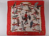 an image of a red scarf with birds on it