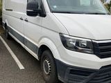 a white van that is parked in a parking lot