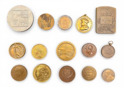 an image of a collection of old and new coins on a white surface