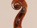 an old violin with a wooden back and a long neck
