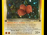 a pokemon card with a picture of two red pokemons on it