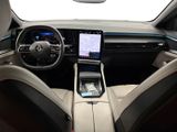 the interior of a car with a touch screen and a steering wheel